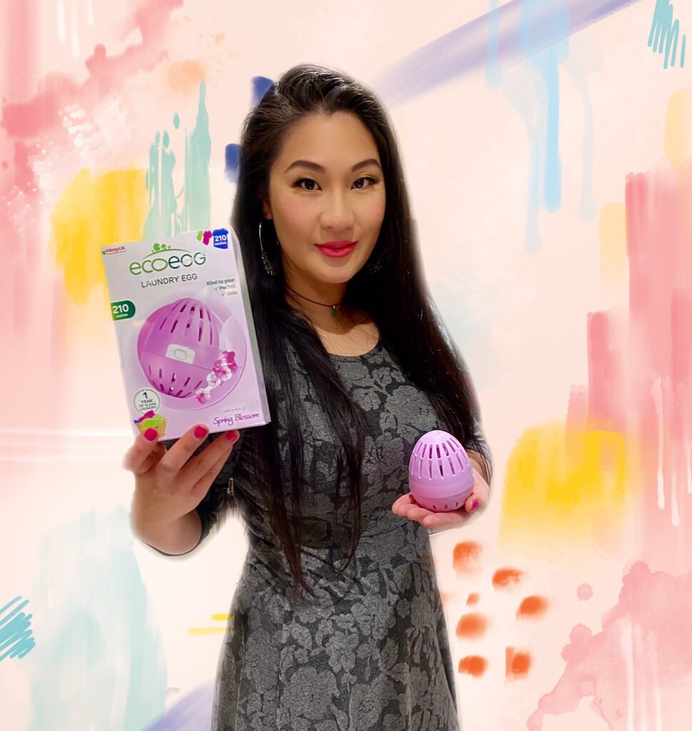 The thrifty island girl Lei Hang also known as the Price Cut Princes on the Bargain Brits on Benefits Channel 5 TV show holding her pin spring blossom eco egg laundry money saving and eco-friendly washing powder alternative.