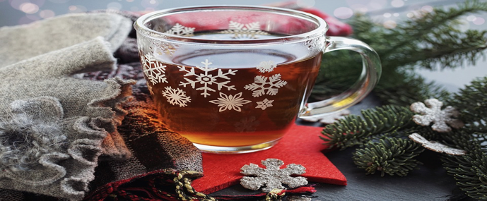 tea in a glass cup with snow flakes 