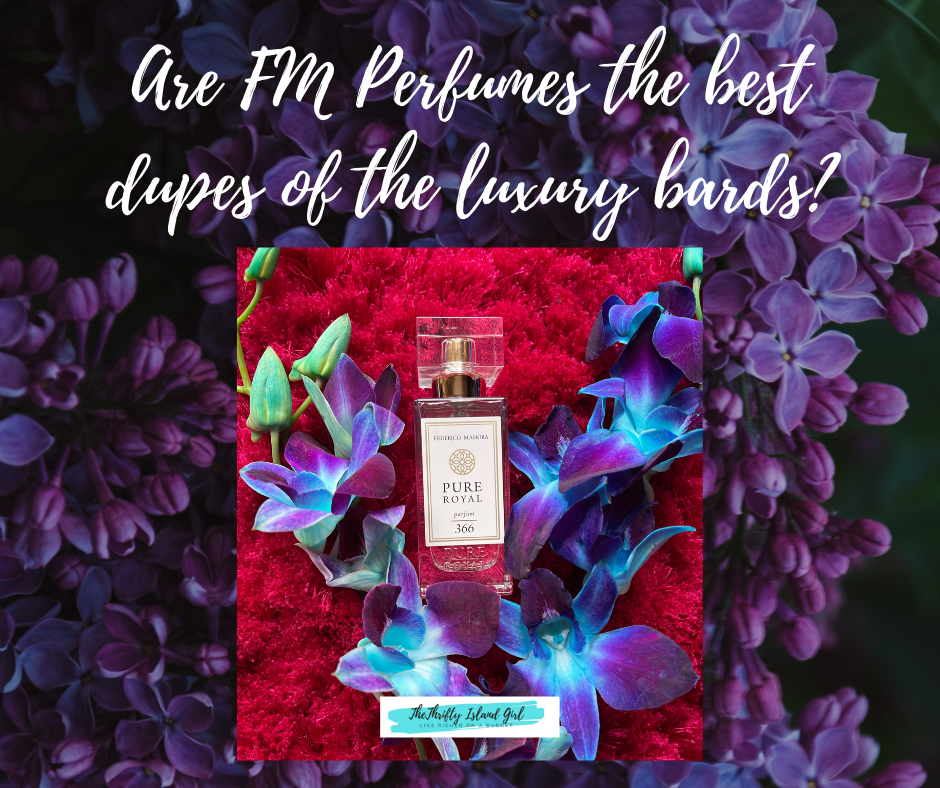 FM World Perfume by Federjco Mahora 366 is a dupe of YSL Black opium. The perfume is on a fluffy pink background with blue purple orchids. Lei Hang review of the FM Pure Royale Perfum 366