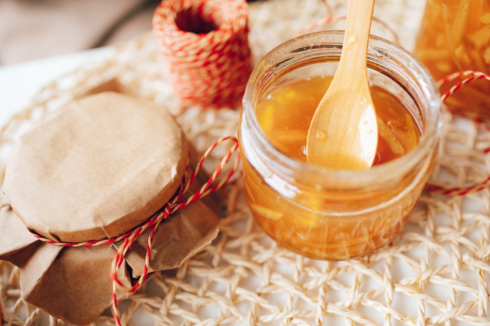 food wood spoon glass home made orange jam. One way to preserve food