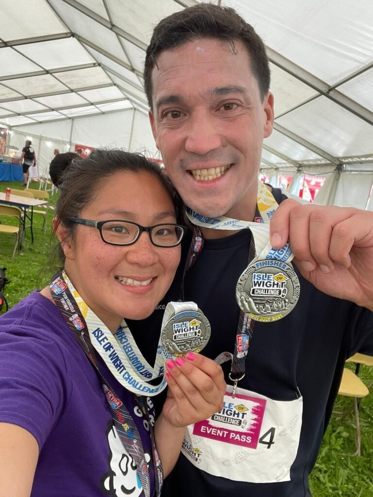 Lei Hang and Oliver Read with their Isle of Wight Ultra Challenge Finisher Medals