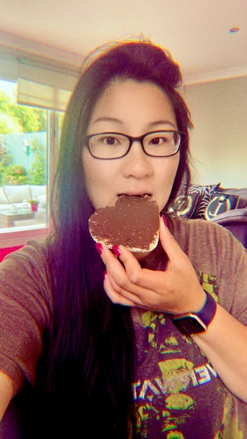 Lei Hang eating a heart shaped toast with Aldi's version of Nutella called Nutoka